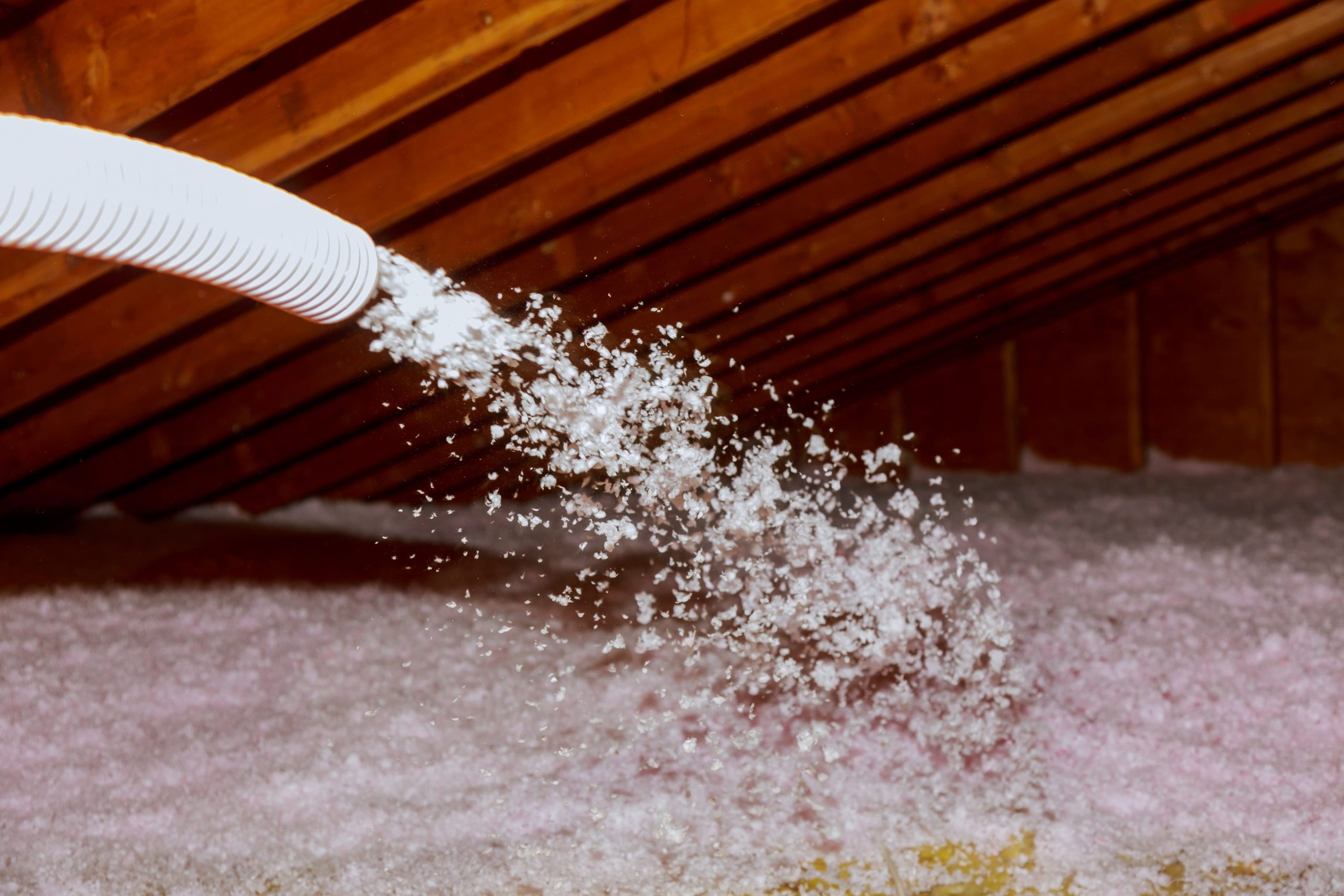 spraying-blown-fiberglass-insulation-for-roof